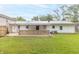 Exterior view of the back of the house with a metal roof and well maintained lawn at 814 N Noble St, Greenfield, IN 46140