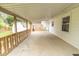 View of the back porch with a wooden railing overlooking a shed and fenced backyard at 814 N Noble St, Greenfield, IN 46140