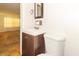 Modern bathroom featuring wood vanity, tiled floors, and natural light at 814 N Noble St, Greenfield, IN 46140