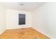 Bedroom offers parquet floors and a large window at 814 N Noble St, Greenfield, IN 46140