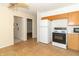 Neutral kitchen with white appliances, tile floors and access to other rooms at 814 N Noble St, Greenfield, IN 46140
