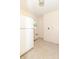 Unfinished laundry room with white appliances, natural light, and connections for a washer and dryer at 814 N Noble St, Greenfield, IN 46140