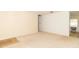 Open living room with neutral carpet, an adjacent room and a view to the kitchen at 814 N Noble St, Greenfield, IN 46140