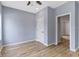 Bedroom features a ceiling fan, wood floors, and a closet at 8355 Fieldfare Way, Indianapolis, IN 46237