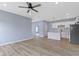 A bright kitchen with white cabinets, stainless steel appliances, and a center island with a breakfast bar at 8355 Fieldfare Way, Indianapolis, IN 46237
