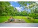 Expansive backyard with a patio dining set, perfect for outdoor entertaining and enjoying the river view at 8842 S Pleasure Valley Rd, Waldron, IN 46182