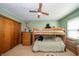 Cozy bedroom featuring a bunk bed, ceiling fan, closet, and natural light from the windows at 8842 S Pleasure Valley Rd, Waldron, IN 46182