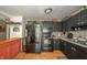 Modern kitchen with black appliances, wood floors, and a cozy design at 8842 S Pleasure Valley Rd, Waldron, IN 46182