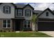 Charming two-story home featuring gray siding, dark accents, and a well-maintained lawn at 900 Cowley Dr, Westfield, IN 46074