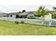 Spacious backyard with a well-maintained lawn, white picket fence, and inviting outdoor space for relaxation at 9022 Hosta Way, Camby, IN 46113