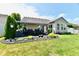 Charming backyard featuring a covered patio, lush lawn, and well-maintained landscaping for outdoor enjoyment at 9022 Hosta Way, Camby, IN 46113
