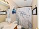 Charming bathroom with sea-themed decor, vanity, and shower with decorative curtain at 9022 Hosta Way, Camby, IN 46113