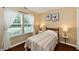 Cozy bedroom featuring bright natural light, hardwood floors, and neutral decor at 9022 Hosta Way, Camby, IN 46113