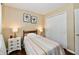 Comfortable bedroom with neutral tones, hardwood flooring, closet, and coordinated decor at 9022 Hosta Way, Camby, IN 46113