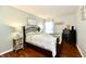 Cozy bedroom with hardwood floors, queen bed, and stylish decor creates a relaxing retreat at 9022 Hosta Way, Camby, IN 46113