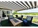 Charming covered patio offers a cozy seating area and scenic views, ideal for outdoor relaxation at 9022 Hosta Way, Camby, IN 46113