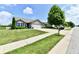 Well-maintained single-story home with an attached garage, manicured lawn, and tree-lined street at 9022 Hosta Way, Camby, IN 46113