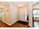 Bright foyer with hardwood floors and white doors, leading to other rooms in the house at 9022 Hosta Way, Camby, IN 46113