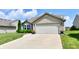 Charming single-story home featuring a well-manicured lawn, attached two-car garage and inviting curb appeal at 9022 Hosta Way, Camby, IN 46113