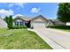 Charming single-story home featuring a well-manicured lawn, attached two-car garage and inviting curb appeal at 9022 Hosta Way, Camby, IN 46113