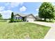 Charming single-story home featuring a well-manicured lawn, attached two-car garage and inviting curb appeal at 9022 Hosta Way, Camby, IN 46113