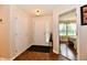 Hallway leading to a bedroom, with neutral paint and a view of a bedroom at 9022 Hosta Way, Camby, IN 46113