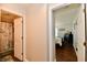 Inviting hallway view with doors to a bathroom and a bedroom showing hardwood floors at 9022 Hosta Way, Camby, IN 46113
