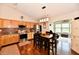 Eat-in kitchen boasts stainless appliances, light wood cabinetry, and modern lighting fixtures at 9022 Hosta Way, Camby, IN 46113