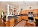 Well-equipped kitchen with stainless steel appliances, granite countertops, and ample cabinet space at 9022 Hosta Way, Camby, IN 46113