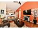 Bright living room features a stone fireplace, vaulted ceiling, and a cozy sitting area at 9022 Hosta Way, Camby, IN 46113