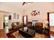 Inviting living room featuring hardwood floors, neutral paint, and vaulted ceilings at 9022 Hosta Way, Camby, IN 46113