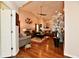 Inviting living room featuring vaulted ceilings, hardwood floors, and comfortable seating arrangements at 9022 Hosta Way, Camby, IN 46113