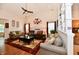 Inviting living room featuring hardwood floors, neutral paint, and vaulted ceilings at 9022 Hosta Way, Camby, IN 46113