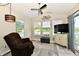 Bright sunroom with a vaulted ceiling, large windows, and comfortable seating at 9022 Hosta Way, Camby, IN 46113