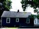 The backyard offers a private retreat, with mature trees and plenty of green space at 94 N Routiers Ave, Indianapolis, IN 46219