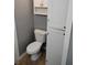 Bathroom with toilet and cabinet at 94 N Routiers Ave, Indianapolis, IN 46219