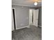 Bedroom featuring neutral paint, carpet, and two closets at 94 N Routiers Ave, Indianapolis, IN 46219