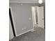 Bedroom featuring neutral paint, carpet, and two closets at 94 N Routiers Ave, Indianapolis, IN 46219