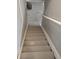 Clean staircase with white railings, connecting different levels of the home at 94 N Routiers Ave, Indianapolis, IN 46219