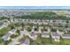 Neighborhood aerial view with lush green trees, well-maintained lawns, and neatly arranged homes at 9724 Brooks Dr, Fishers, IN 46055