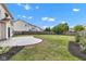 Spacious backyard with a well-maintained lawn, stamped concrete patio, and wood fence, ideal for outdoor activities and relaxation at 9724 Brooks Dr, Fishers, IN 46055