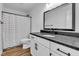 Bathroom features a large vanity with black fixtures and a black and white shower curtain at 9724 Brooks Dr, Fishers, IN 46055