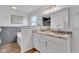 Bathroom featuring a double vanity with marble countertops and a large soaking tub at 9724 Brooks Dr, Fishers, IN 46055