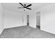 Bedroom features plush carpeting, a ceiling fan, plus an adjacent door to another room and a walk-in closet at 9724 Brooks Dr, Fishers, IN 46055