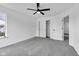 Bedroom boasts plush carpeting, a ceiling fan, and a closet plus an adjacent door to another room at 9724 Brooks Dr, Fishers, IN 46055