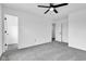 Bedroom featuring plush carpeting, a ceiling fan, and two doors leading to other parts of the home at 9724 Brooks Dr, Fishers, IN 46055