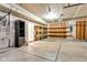 Garage with storage shelves, utility unit, and ample open space providing organized storage and functional workspace at 9724 Brooks Dr, Fishers, IN 46055