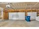 Spacious two car garage featuring a concrete floor and white doors at 9724 Brooks Dr, Fishers, IN 46055