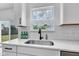 Close-up of kitchen counter, modern faucet, and subway tile backsplash at 9724 Brooks Dr, Fishers, IN 46055