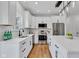 Well-lit kitchen with stainless steel appliances, granite countertops, and hardwood floors at 9724 Brooks Dr, Fishers, IN 46055